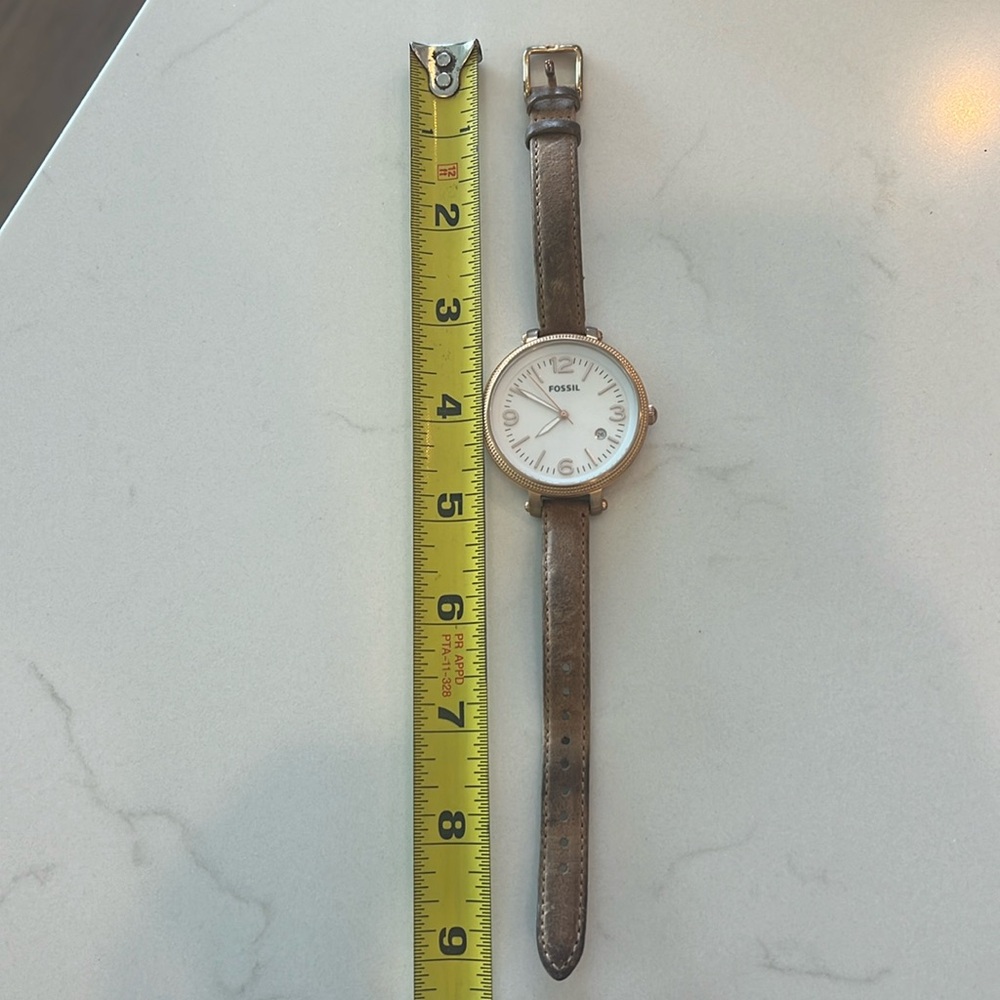 Fossil Woman watch with 2 in diameter face with 1/2 in leather band